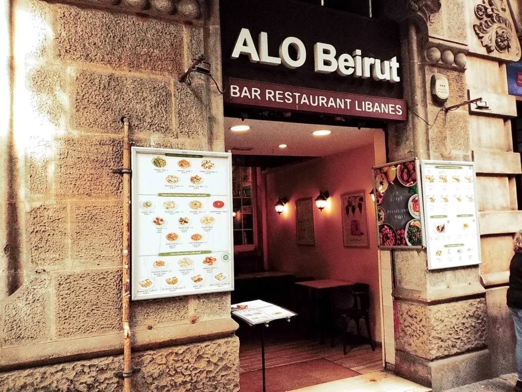 Block - Left - 14 of 16 - Petsolt Family Front of a stone Beirut Lebanese restaurant with large white sign 'ALo Beirut' and menu boards outside the entrance.