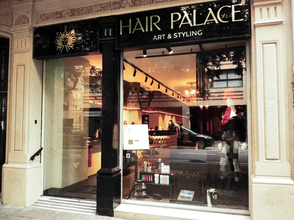Block - Mountian - 6 of 13 - Petsolt Family Storefront sign reads Hair Palace Art & Styling with a window display of hair products inside the salon.